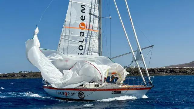 A spectacular sail change for the race leader. Guillou brings down spinnaker aboard Rustler 36 SOLAREM during the Lanzarote film drop. French skipper reached Marina Rubicón first, before anchoring to complete an unaided masthead repair & continuing south